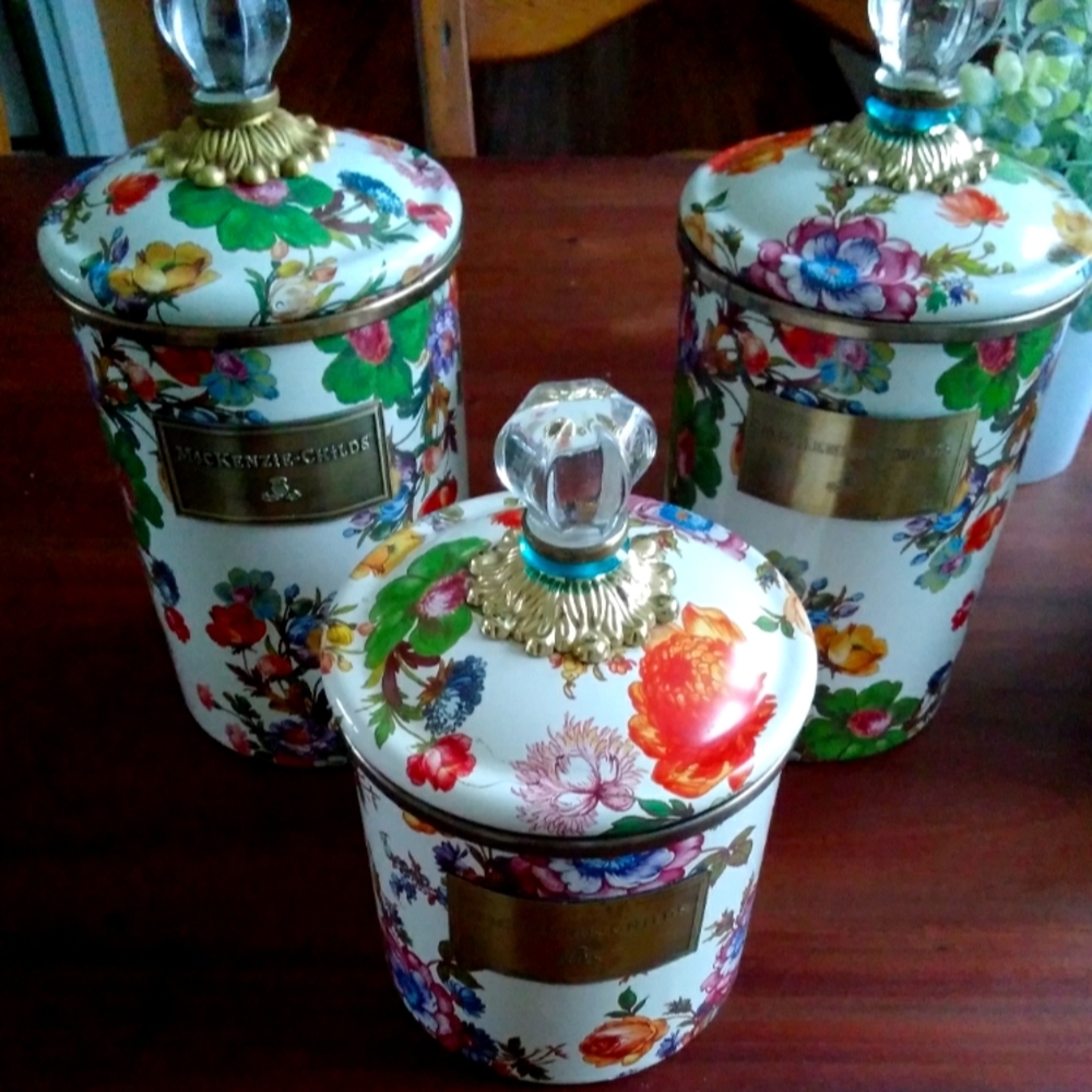 Two large and one small Mackenzie-Childs canisters